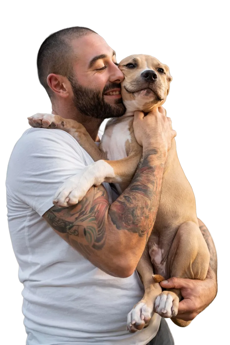 A man affectionately holding his puppy