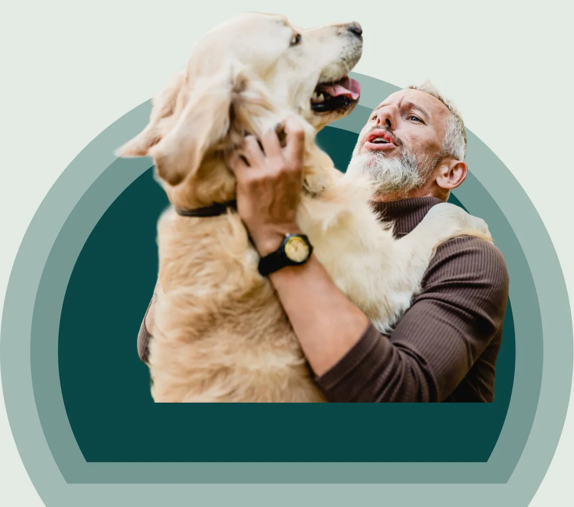 A person embracing their service dog